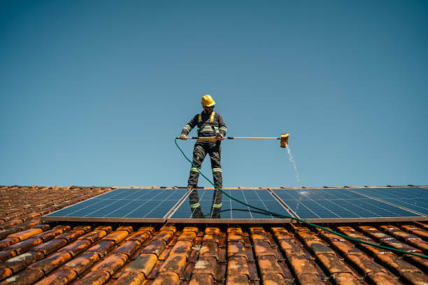 Solar Panel Maintenance in Cannington Worker washing solar panel on roof